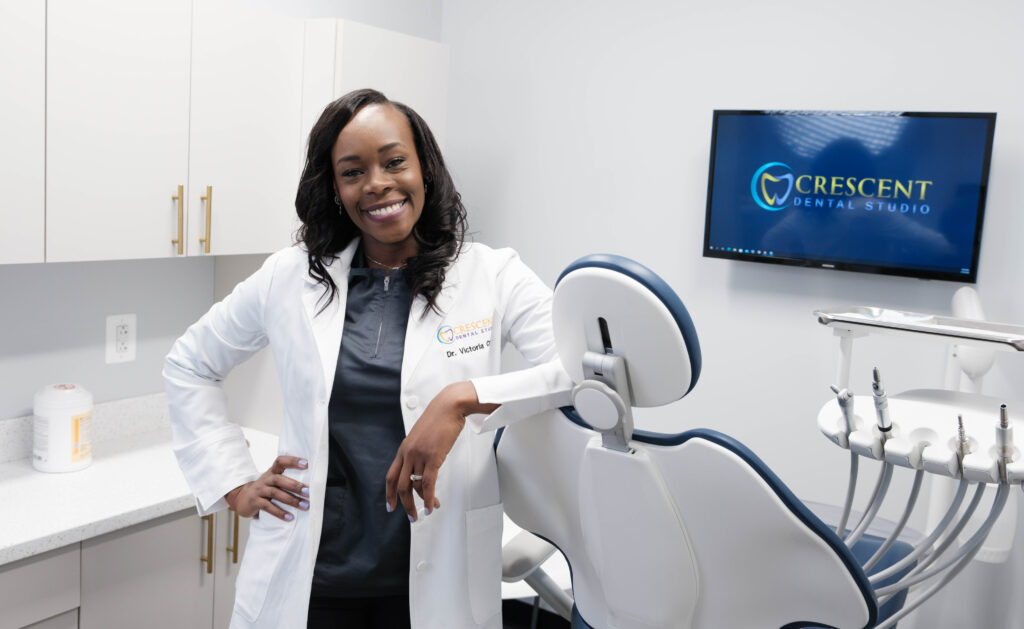 Dr Crow leaning against dental chair at Crescent Dental Studio