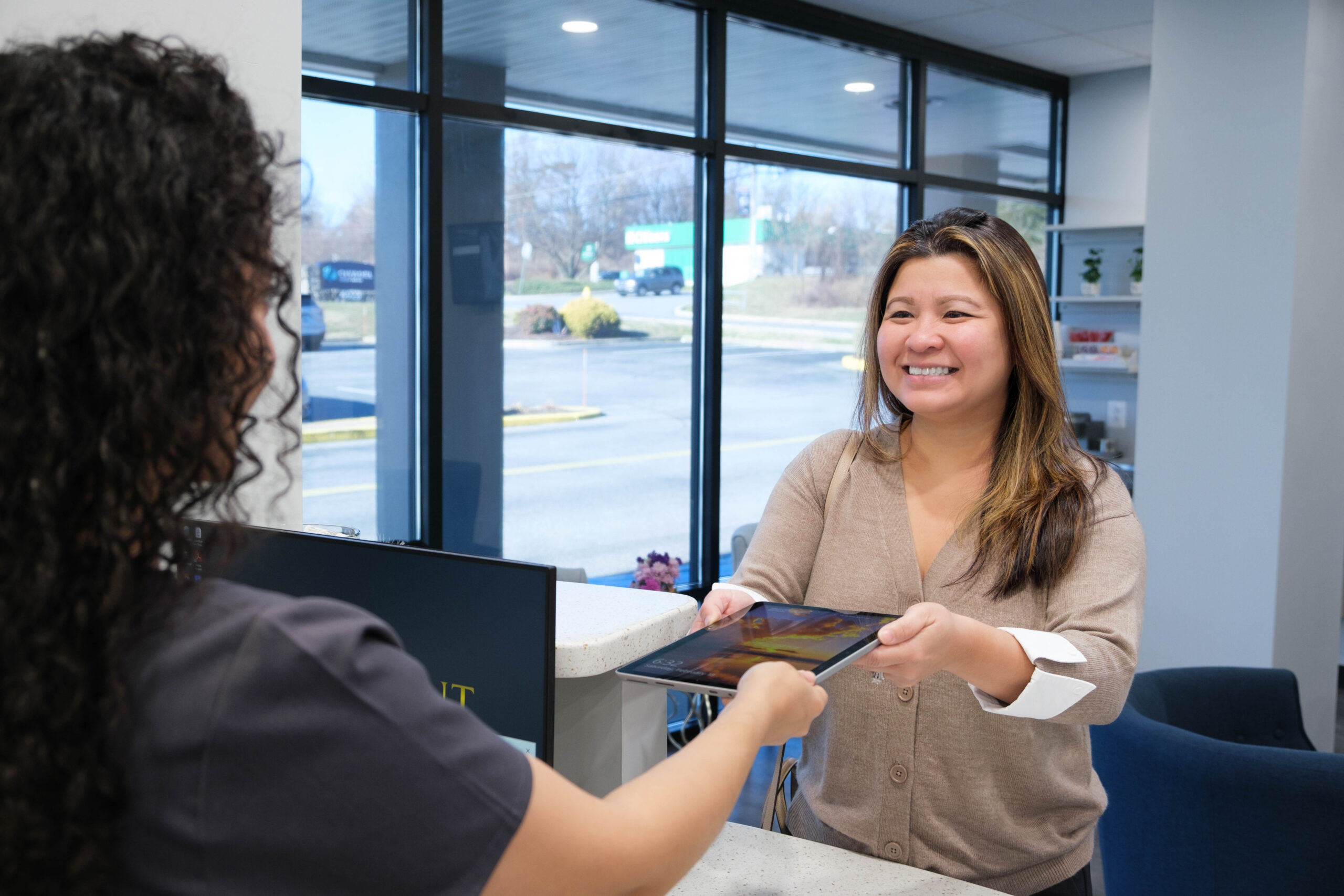 Dental patient starts check in process for dental procedure