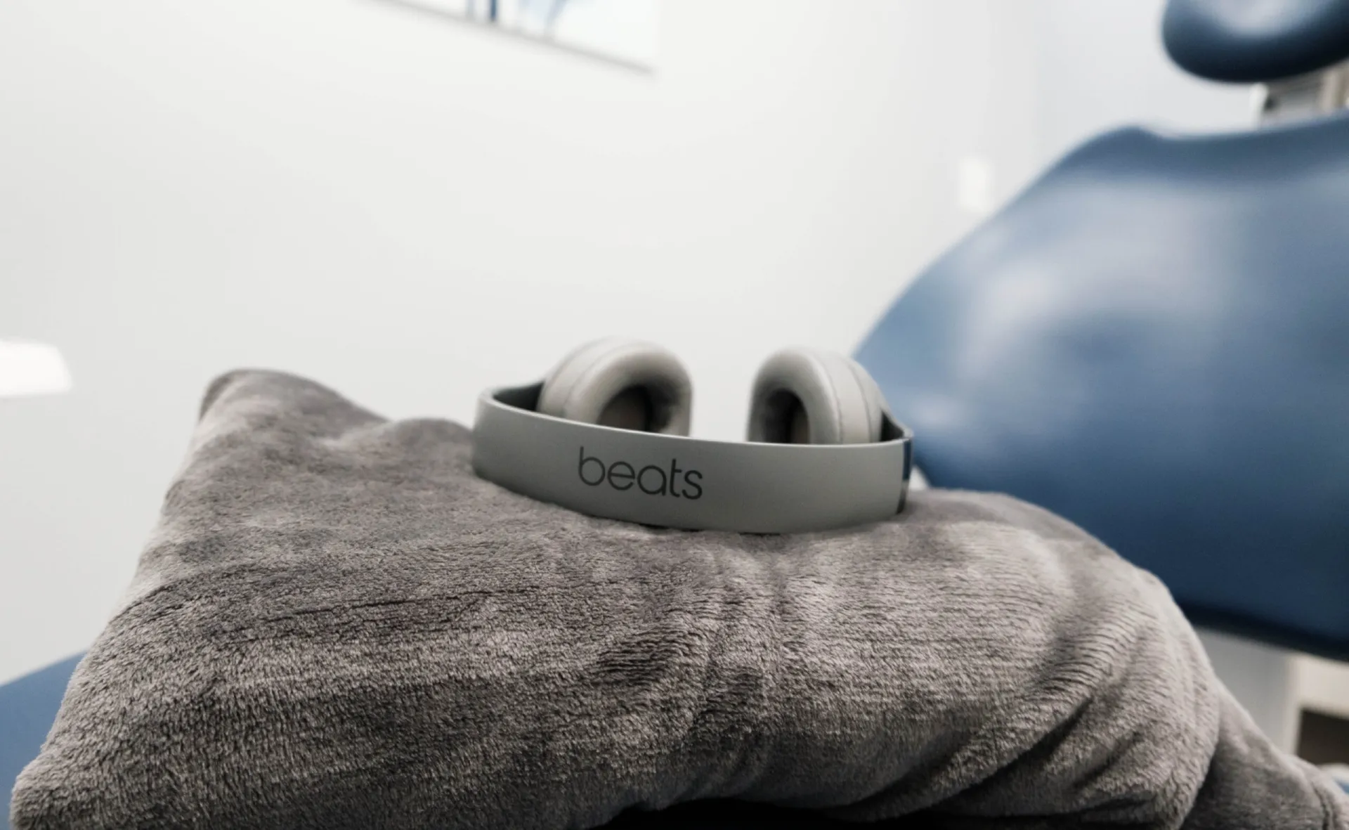 A pair of headphones sitting on a blanket at Crescent Dental Studio