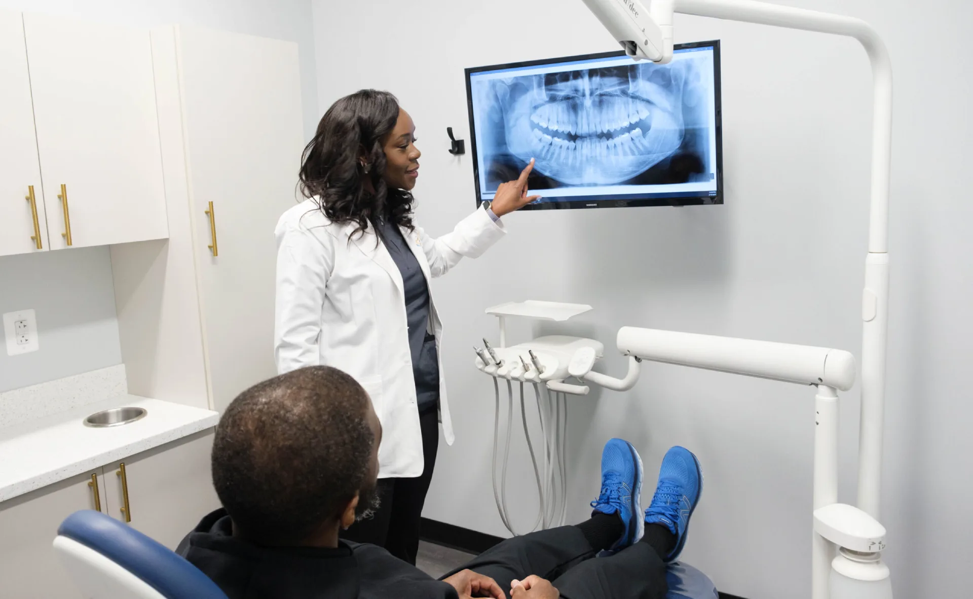 Dr. Crow showing dental x ray results